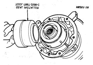 21. While rotating the case assembly on the mainshaft to center the bearings. Apply pressure up and down while taking an end play reading. A reading of 0.0019-0.0039 inches is required.