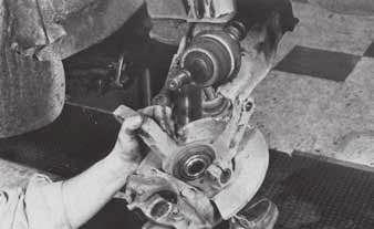 Ford and Chrysler Bearing/seal reassembly 1. Place the knuckle assembly on the ball joint stud (ig. 35). By hand, push the shaft into the hub as far as possible.