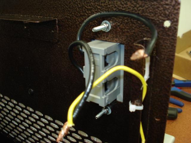 Next, locate the terminal wires of the thermostat and take off the wire caps that secure them to the wiring of the heater.