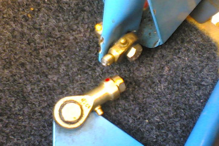 3. Prepare to drill the mounting holes for the control columns. Position the FBR-1 nylon bearings, with the control column in them, on the floorboard over the two steel mounting channels.