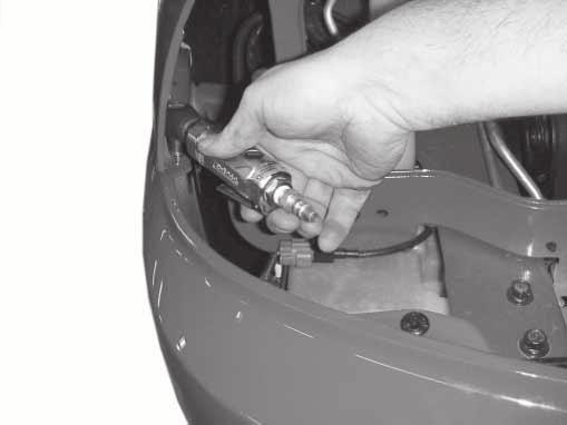 Remove one screw from each side, facia to fender.