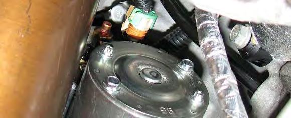 Use a 13mm socket to remove the nuts retaining power wires to the starter. 13. Remove the starter and bracket. 14.