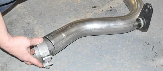 stock exhaust. NOTE: The use of a soap and water solution may aid in the installation of hanger grommets 6.