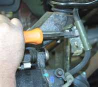 32. Reinstall the OEM rotor & brake caliper. Disconnect the ABS lines from the frame & remove the OEM clip located at the middle of the line.