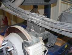 Raise the axle up to the rear springs. Make sure the new block is properly seated on the axle & the tie bolt in the spring seats properly into the new block.