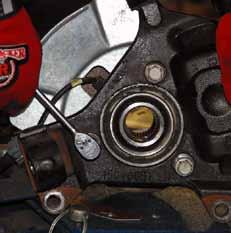 Remove the upper & lower A-arm ball joints from the steering knuckle using a 18mm socket.