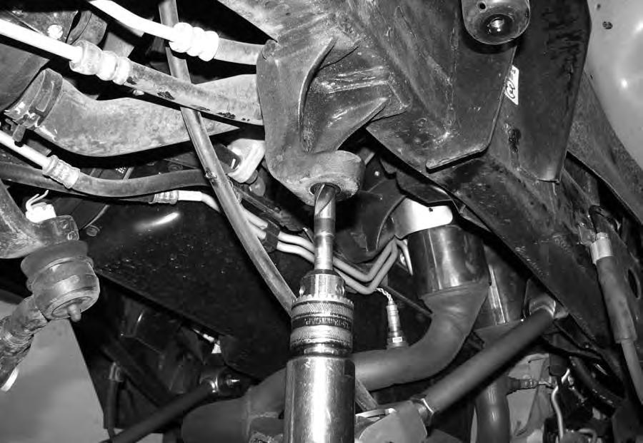 Drill the frame side track bar mount hole to 5/8". 12 Install front lower control arms one at a time.