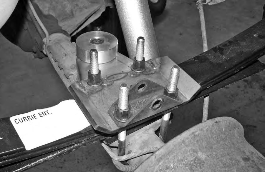 Rear Installation 18. Place jack stands under the rearend, While supporting the rearend with a floor jack, remove both rear shocks.
