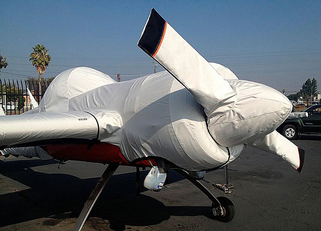 front of the cowling. The Insulated Engine Cover is attached with a belly strap aft of the firewall, and can Velcro to the Canopy Cover if desired.