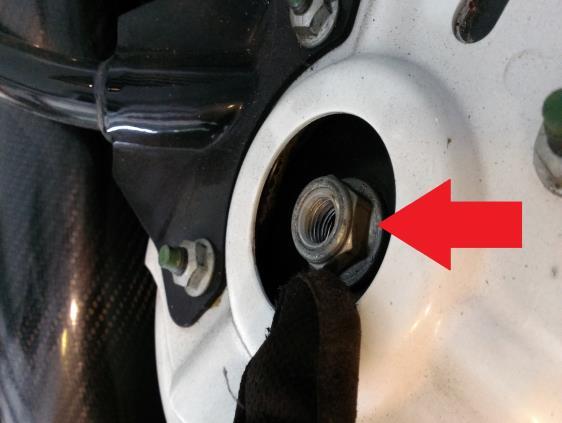 Place wheel chocks on rear wheels and engage parking brake Step 2. Loosen the nut at the top of the shock. Lift the hood at access. Step 2. Loosen lug nuts on front wheel (13/16 ) and remove wheels and then jack the front of the car up.
