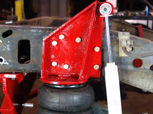 11. Install the track bar with the bushing end mounted to the frame side bracket and the heim joint on the axle end.
