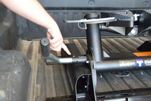 To move the hitch head towards the rear of the truck bed, apply the brakes on the trailer.