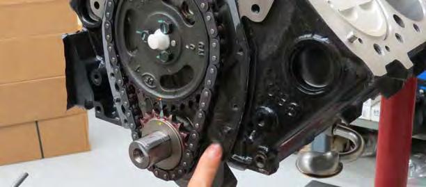 Using a mallet and flat piece of wood, or equivalent, press the crank seal into the supplied timing cover as shown.