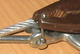 away the Cotter Pin by holding head of