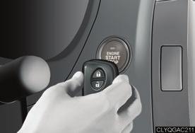 [10 mm]), making sure that the button side of the key is facing toward you. Press the engine switch within 5 seconds of the buzzer, keeping the brake pedal depressed.