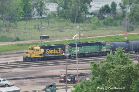 With the help of my telephoto lens, I was able to get this photo of BNSF #2572 (GP35u) and BNSF #3121 (GP50) idling in the yard.