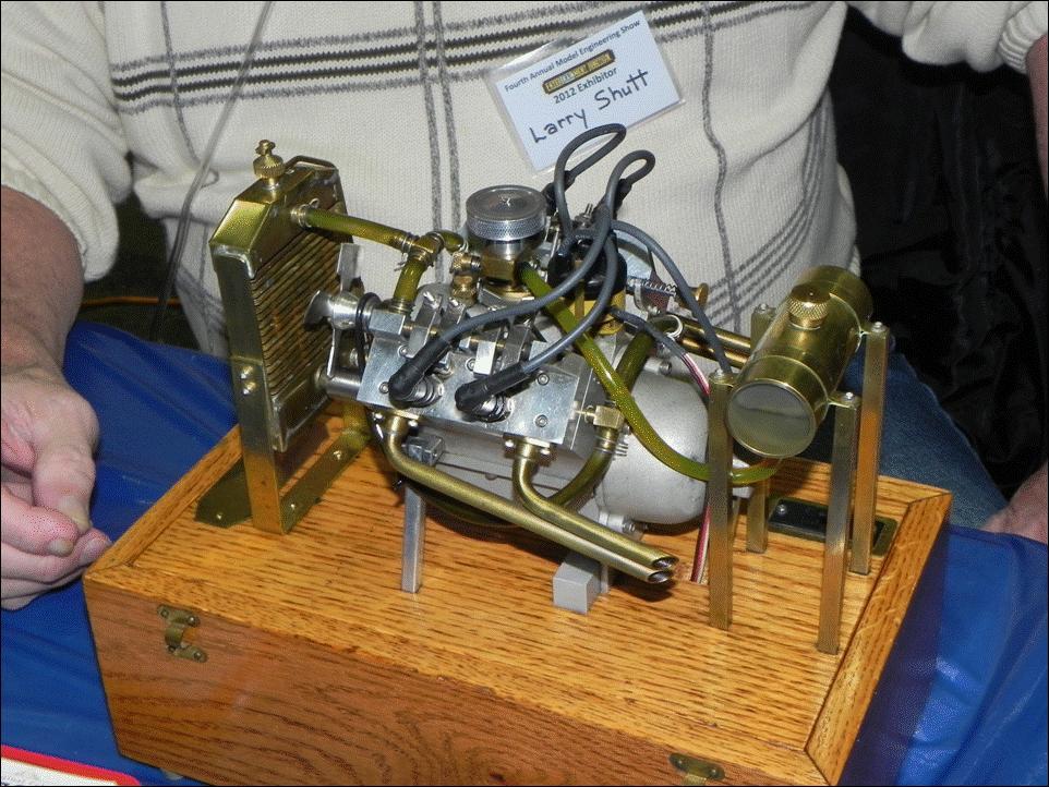 Figure 3 shows a completely different type of model, a functioning miniature liquid-cooled V-4 automotive style engine. It had its own radiator, cooling fan, spark plugs, carburetor and air filter.