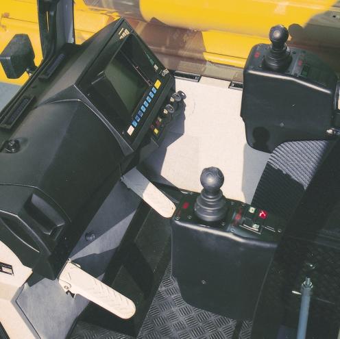 Spring-mounted and hydraulically cushioned crane operator s seat with pneumatic lumber support and headrest Operator-friendly armrest-integrated controls, vertically and horizontally adjustable