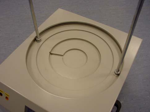 3.2 Position the shaker on a suitably level, rigid and robust surface (placing the machine on a level surface ensures the even distribution of the sample over the sieves).