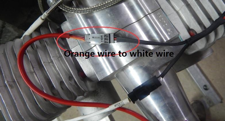 The orange wire from the stock pickup sensor