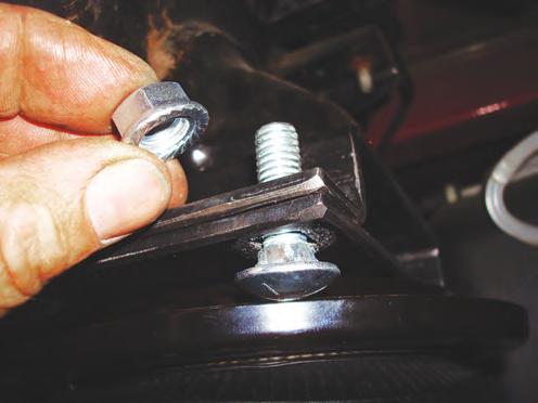 7. Raise the axle back up while aligning the air spring mounting plate s carriage bolts, with