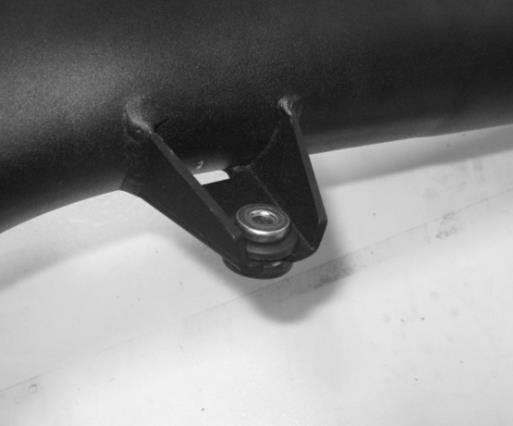 7. Remove both of the rubber isolators and steel inserts from the factory clean air tube mounting