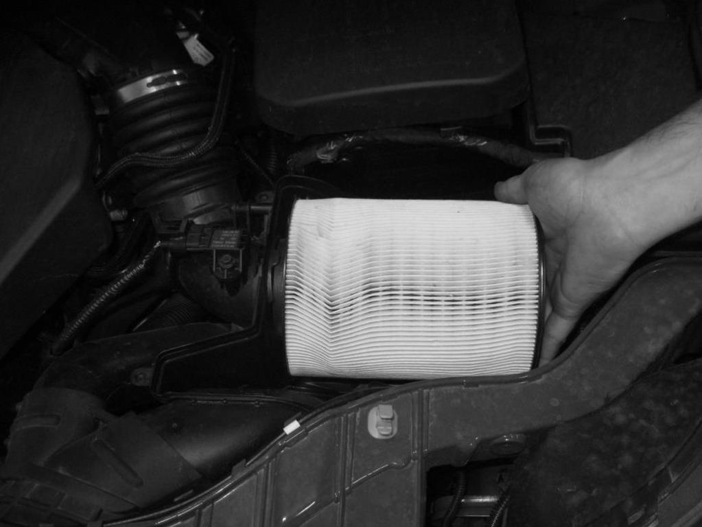 2. Remove the stock Air Filter by pulling it directly off of the MAF Tube. Pull out towards fender and upward.