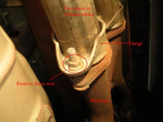 4. Using a 9/16 inch socket, remove the nuts behind the flange connecting cat-back to the mid-pipe.