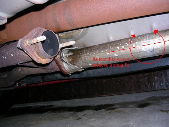 14. Once you have the exhaust tube connected to the mid-pipe, rotate the exhaust tube back so it bends out and away from the driveshaft.