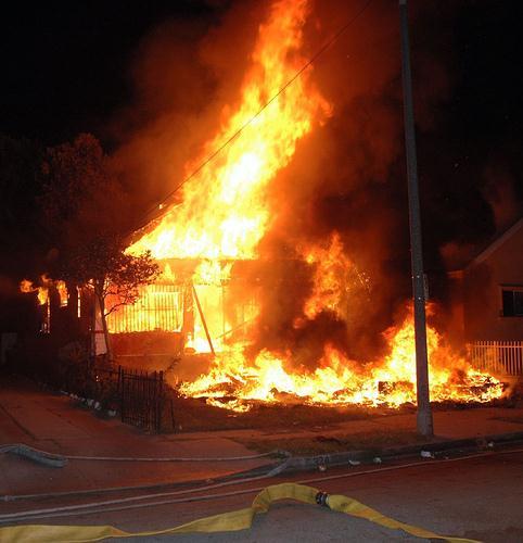 When arriving at a residential structure fire it is best to drive past the incident.