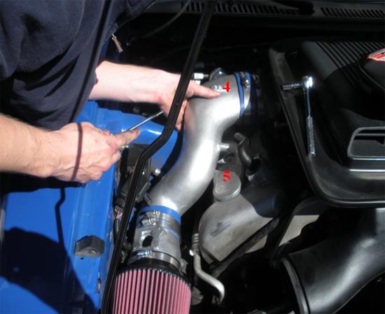 6. While installing the inlet pipe you will notice a black rubber EGR hose on your engine.