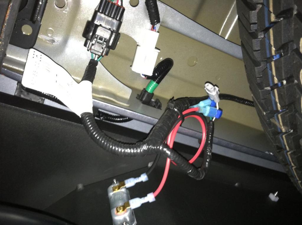 N. Re-Install the modified factory harness and connect to the license plate lights as shown in Figure 9. Use zip-ties to secure excess wiring. Figure 9 O.