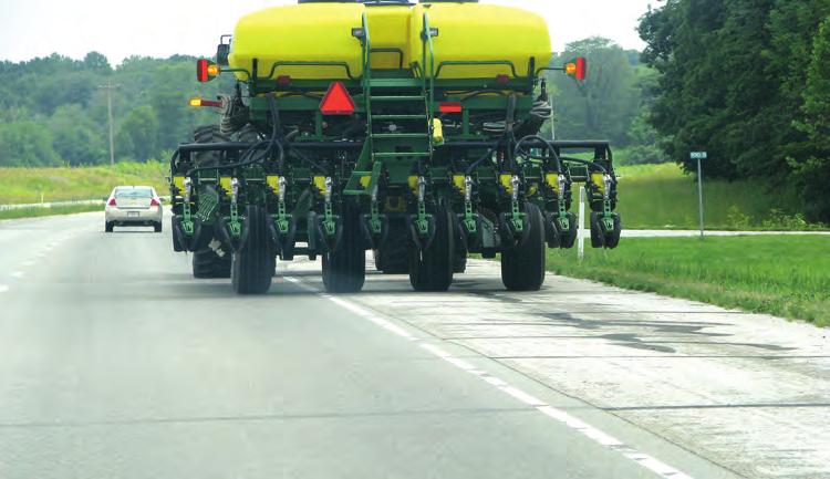 A well-designed implement of agriculture with slow moving vehicle sign, lights, turn signals, reflectors, and reflective tape. Lights and Reflectors.