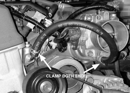 Remove Upper Vacuum Hose Lower Vacuum Hose e) Drain approximately 1 gallon of coolant from the radiator into the proper container.