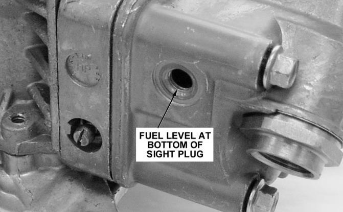 Place the carburetor in position over the four stud bolts and secure in place. To avoid warping the carburetor flange, tighten each bolt gradually. Tighten in a criss cross pattern to 60 in./lbs.
