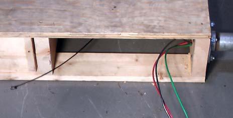Push the tape through the hole in the bottom of the electrical box into the conduit.