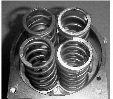 The air connection plate (6) can be removed from the body if necessary by unscrewing the two cap head bolts. 9. Remove o-rings and support rings from the piston heads 10.