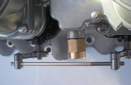 Three-carburetor systems only need two springs - fit one to the carburetor which is linked to the throttle pedal.