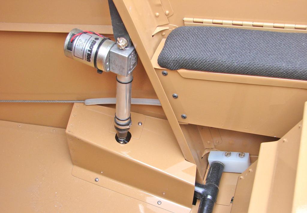 Electric flaps: The stock flap actuator weldment has a lateral tube behind the seat, two arms that go aft and, an actuating handle that goes forward next to the pilot's left leg.