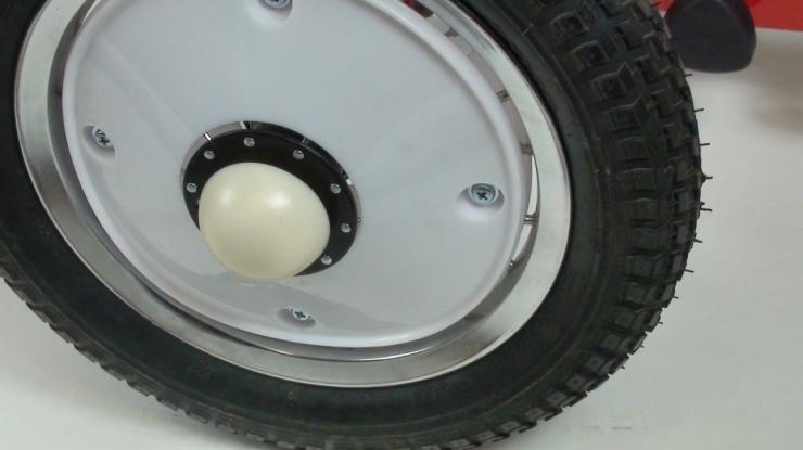 Install white plastic nut caps over axel nuts once wheels