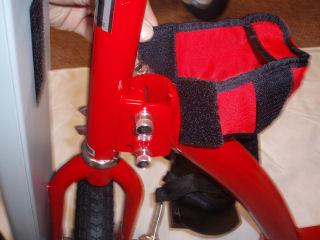13. Install Hinge Wrap. The hinge wrap is a safety pad to protect the rider s knees from hitting the hinges. It must be installed as shown before riding the AmTryke. See Figures 19-20. Figure 19.
