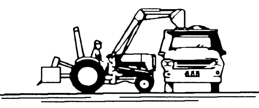 9.3. DUMPING THE BUCKET Lift the bucket just high enough to clear the side of the vehicle. Move the tractor in as close to the side of the vehicle as possible, then dump the bucket. 9.4.