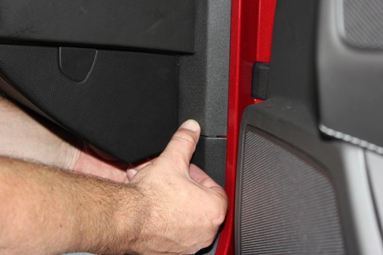 Replace plastic door jamb trim while routing wires into passenger compartment.