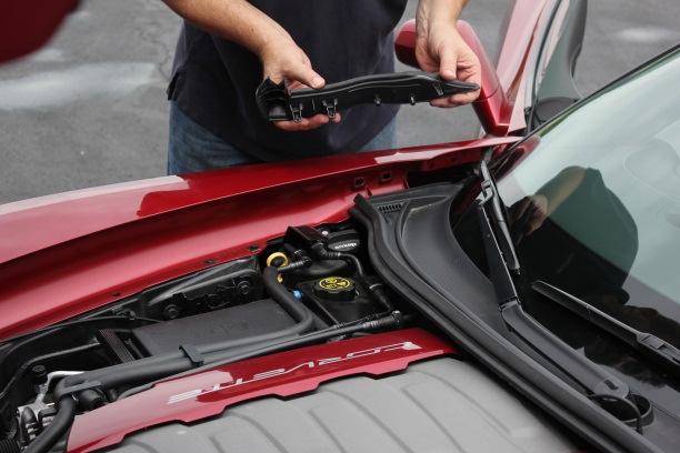 I. Prepare vehicle: Remove under-hood trim piece Page