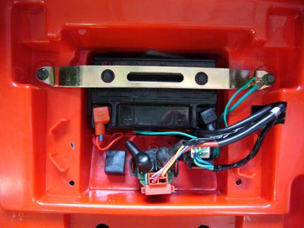 When the battery is full, flush with water any acid that may be on or around battery and then test for proper voltage.