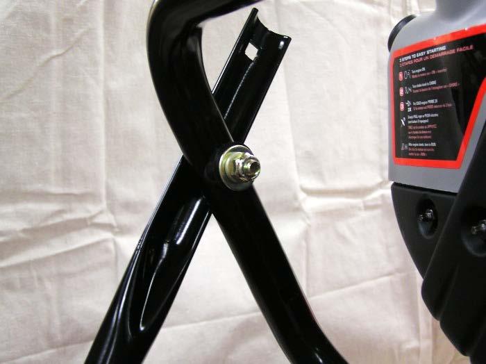 Attach upper handlebar assembly to lower handlebar using two sets of the handlebar hardware.