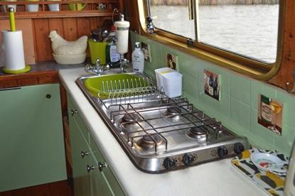 Appliances: Vanette, built-in eye level gas oven and grill. Primus gas hob combined with a stainless steel sink and drainer.