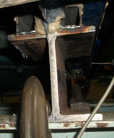 (6) If the rocker panel pinch weld flanges are vertical or approximately vertical with respect to the ground, build an I-beam structure to support each pinch weld flange as described below.