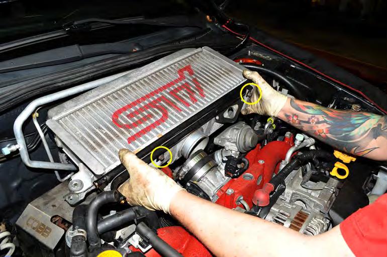 8. Grab the intercooler by the sides and carefully wiggle it out of the engine bay.