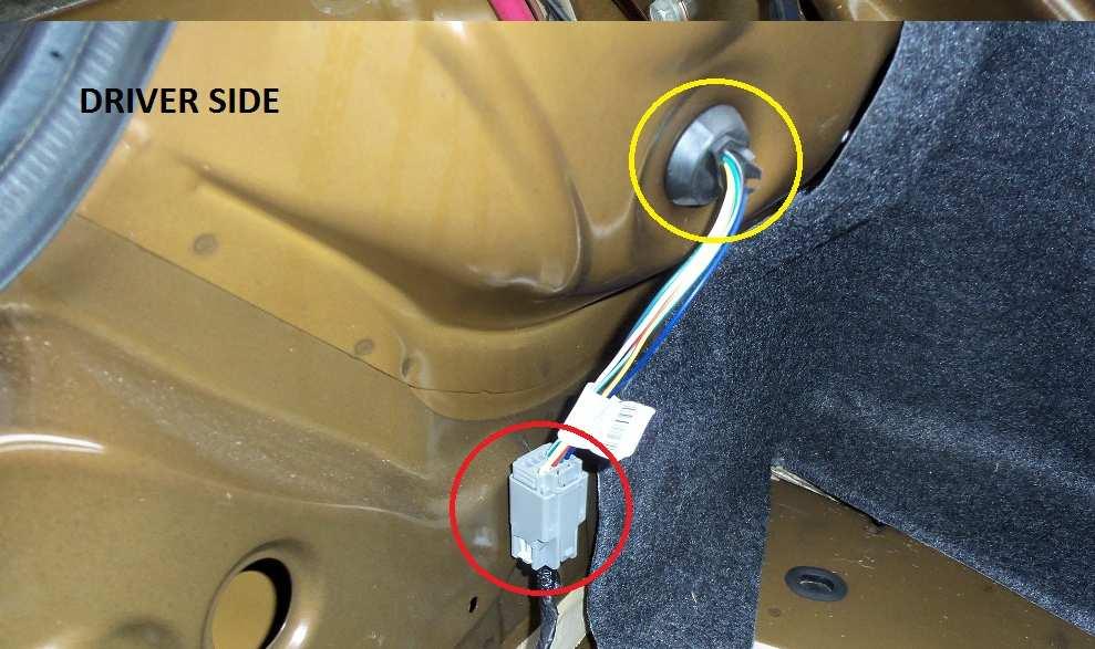 Move the panel forward just enough to locate the trunk light electrical connector (REF 2, WHITE circle).
